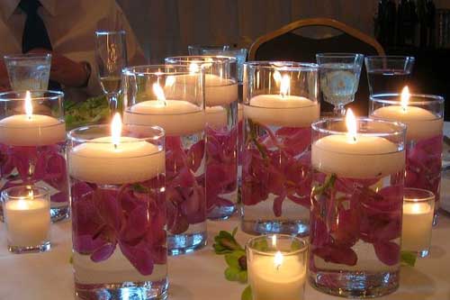 Centrotavola matrimonio, fiori e vasi con candele