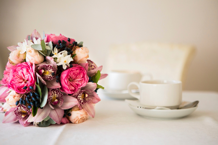 Bridal bouquet of peonies and coffee